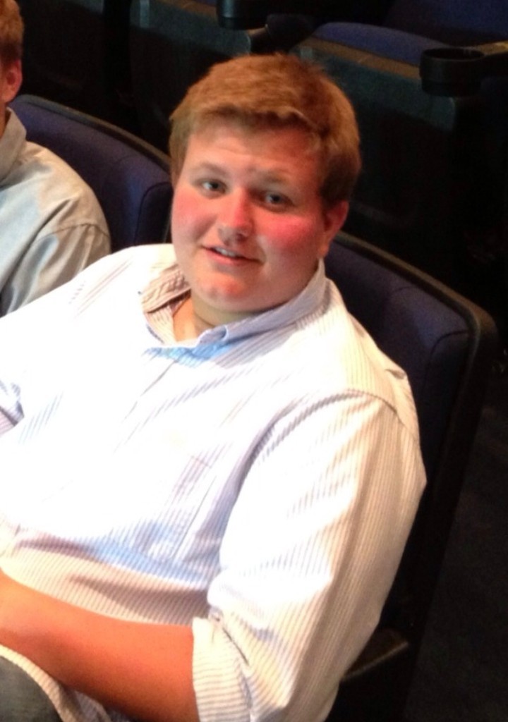 Chase Morris in a striped button-up shirt, candid